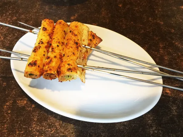 干豆腐でネギなど巻いたもの？ ハオチー。