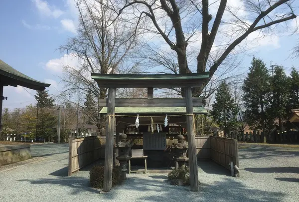 願かけ石