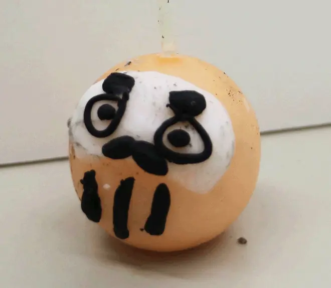 桃色ダルマのロウソク人形